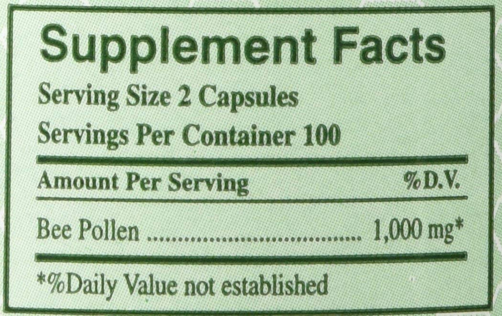 Close-up view of YS Organics Bee Pollen capsules in a pack of 2