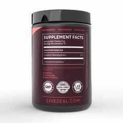 Creatine powder being measured into a shaker bottle