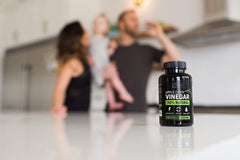 Raw ACV capsules product shot with cayenne pepper detail