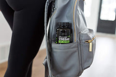 Zeal Naturals ACV capsules on a breakfast tray suggesting daily routine.