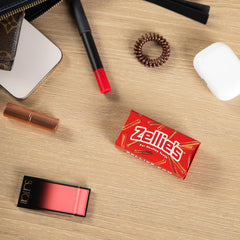Close-up of Zellies On-The-Go tin showing the empty fillable container.