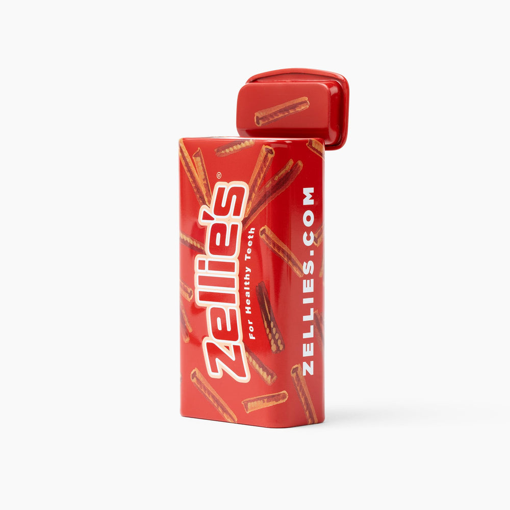 Zellies On-The-Go Tin placed in a purse to show portability and size.