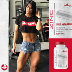 Serving of zinc capsules on white background