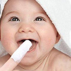 Gauze cleaning baby's gums, teeth and tongue coating