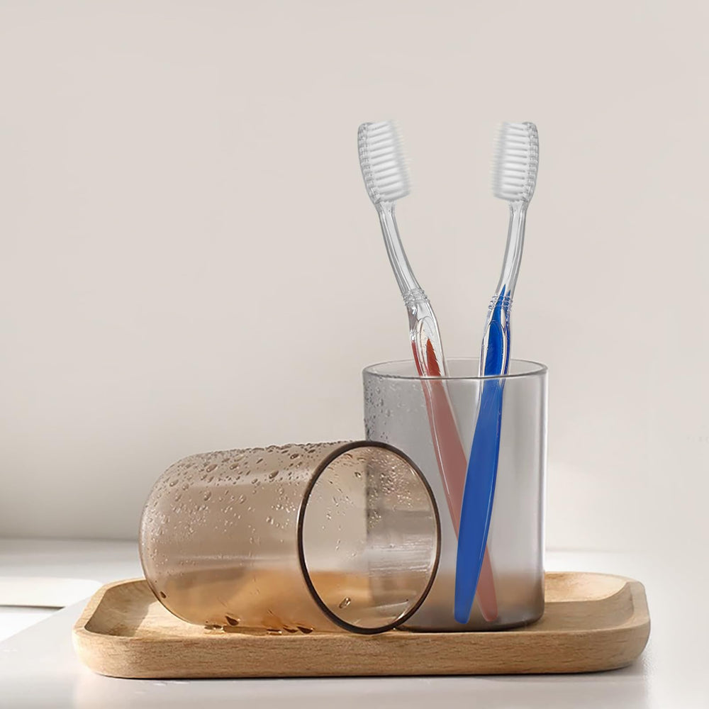 Red disposable toothbrushes suitable for homeless care packages and travel
