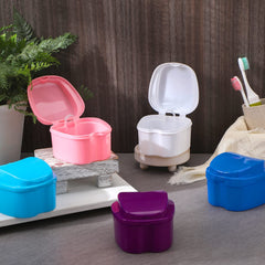 Open view of denture case with drain basket for soaking