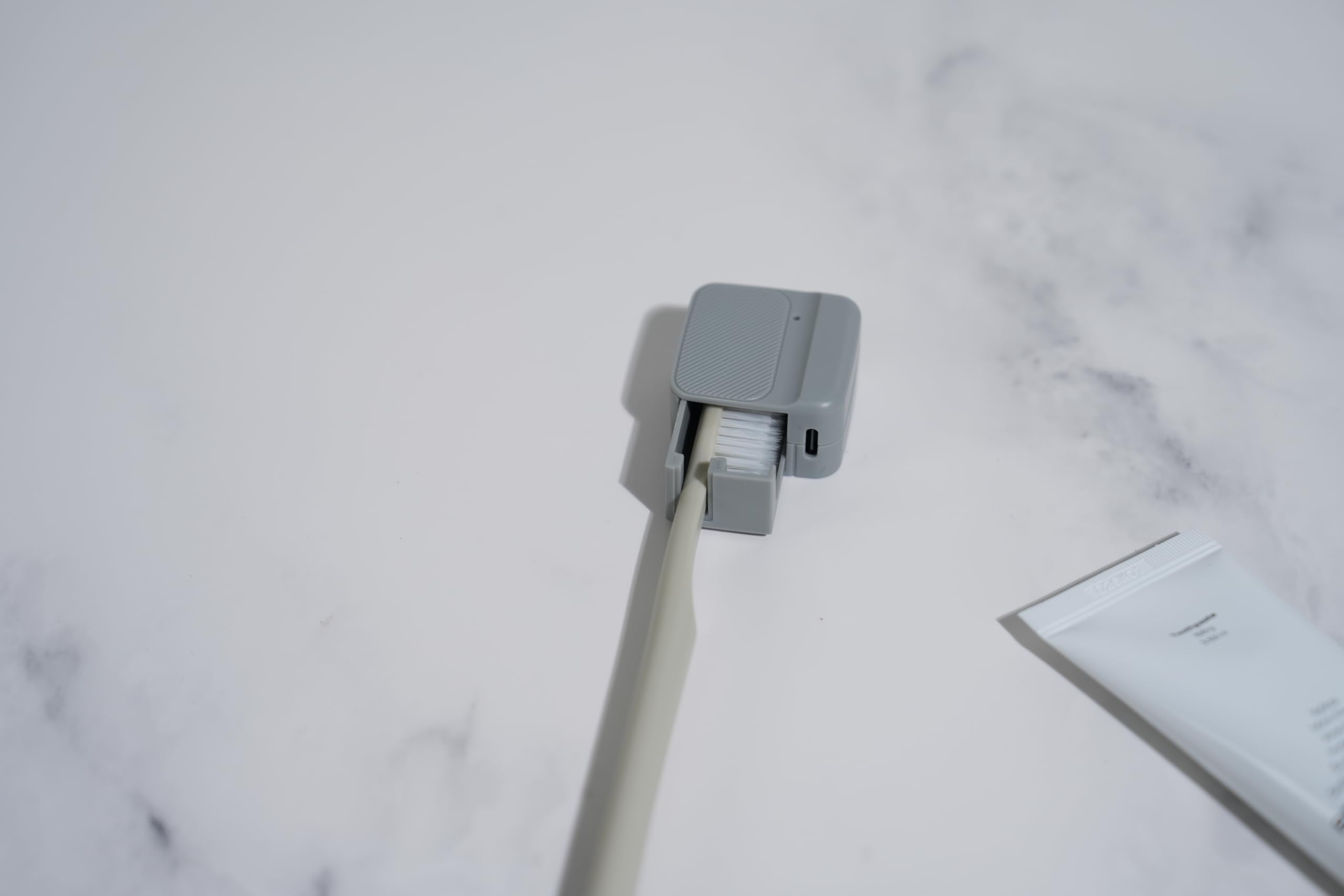 Purifier demonstrates universal compatibility with any toothbrush