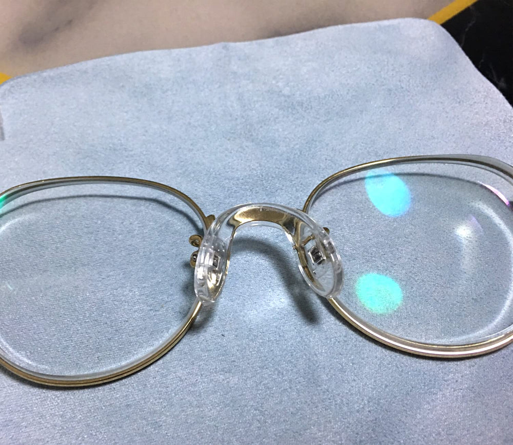 Assorted eyeglasses frames showing silicone nose pads installed