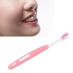 Orthodontic interdental brush reaching between teeth