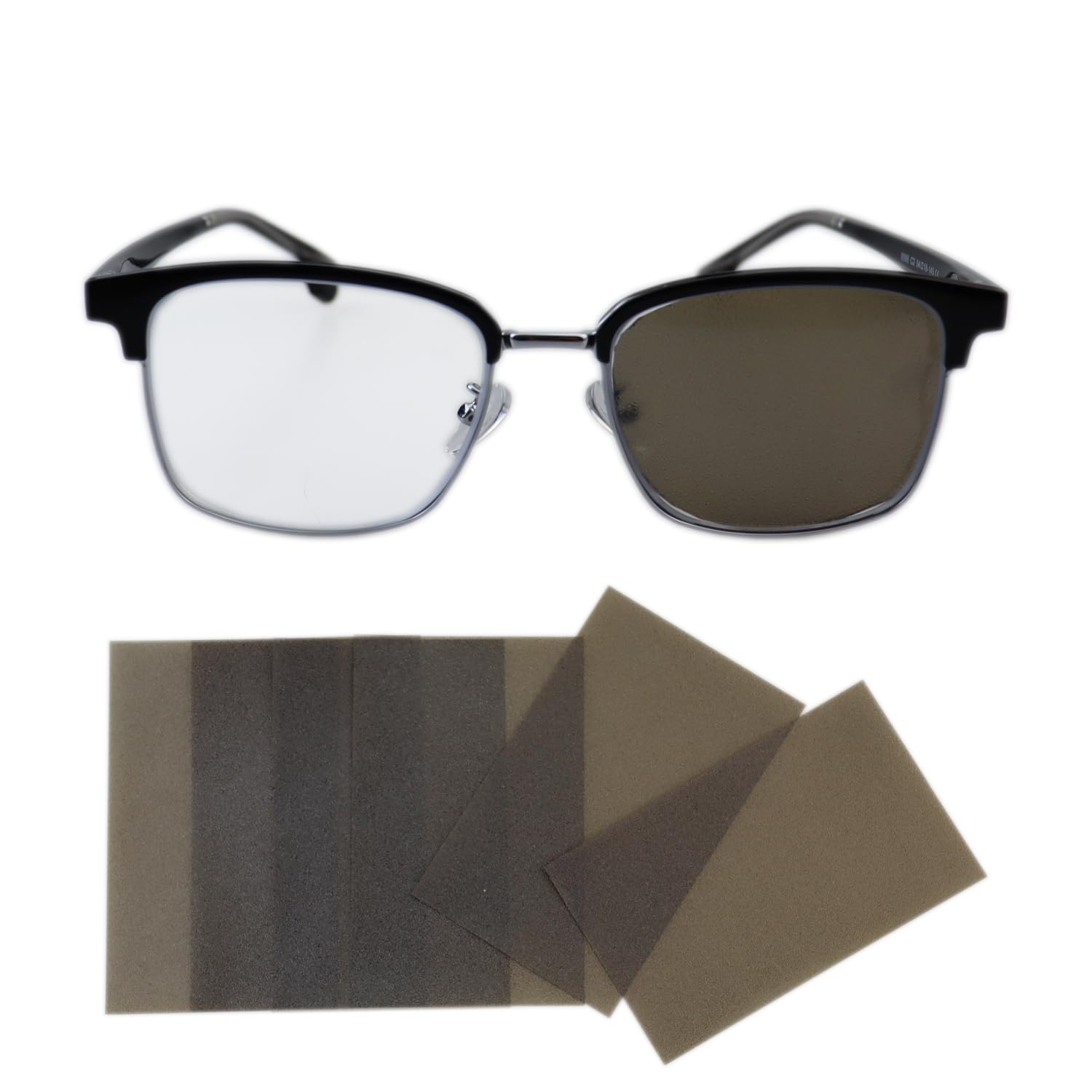 Front view of a pair of glasses with a translucent tea-color eye patch attached