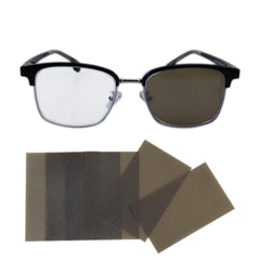 Front view of a pair of glasses with a translucent tea-color eye patch attached