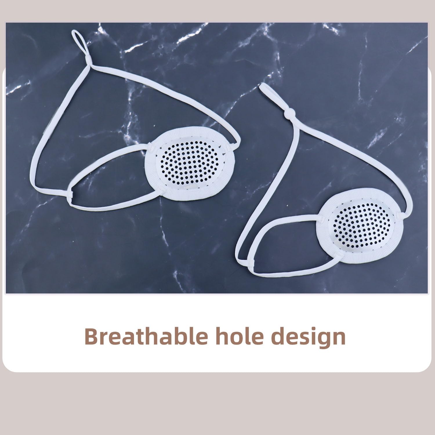 Ventilated convex eye shield with adjustable head strap, front view