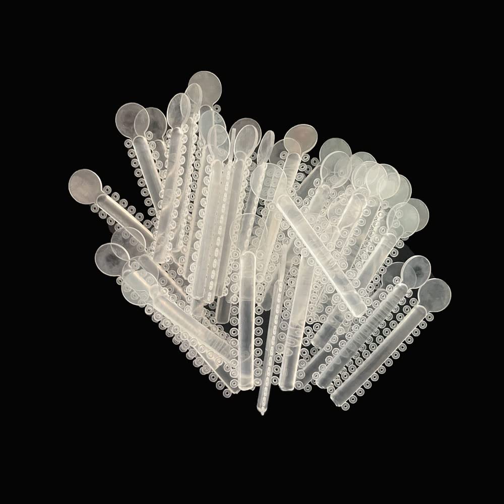 Two bags of elastomeric ligature ties for braces, 2080 pieces total.