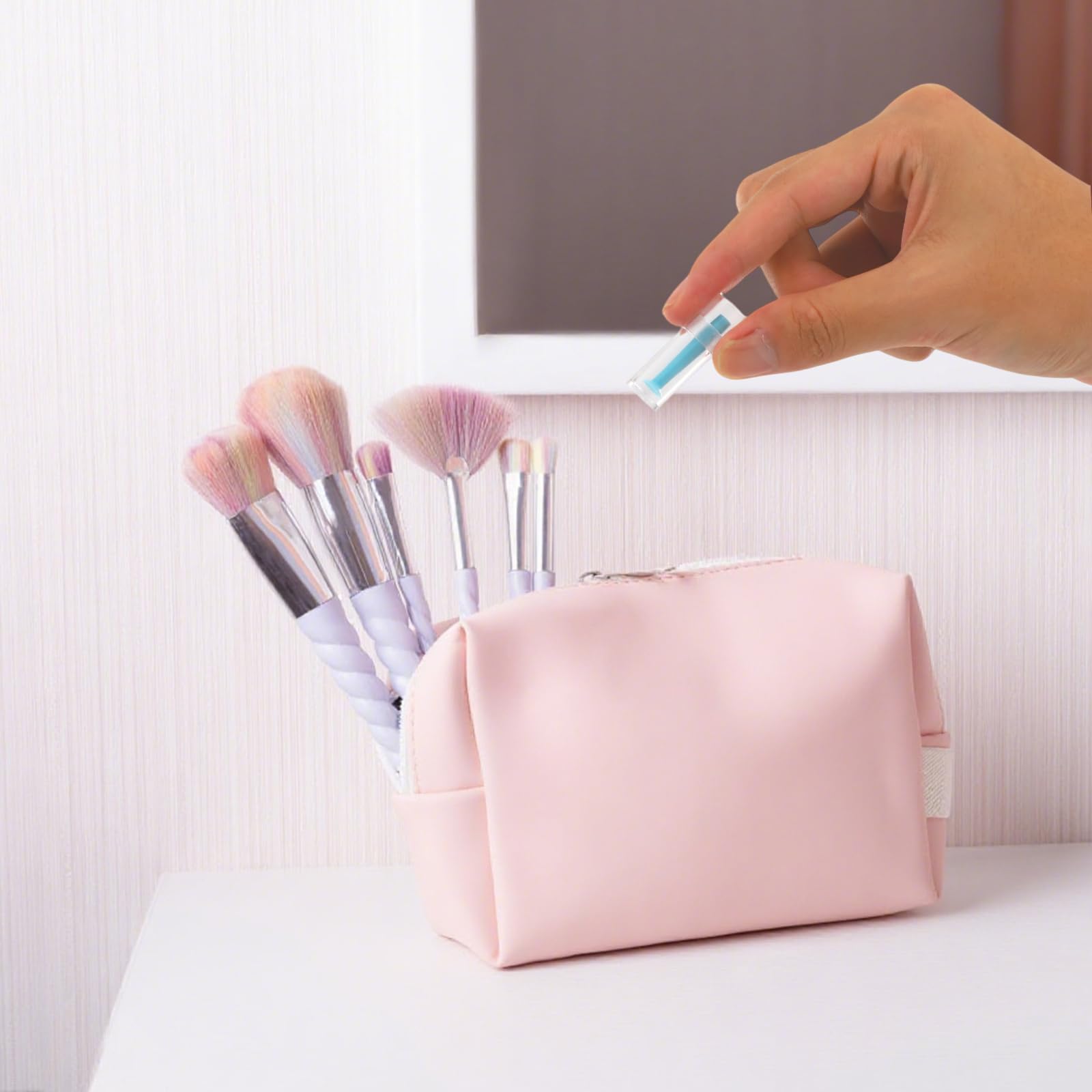 Compact travel-friendly contact lens plunger with storage bottle