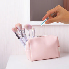 Compact travel-friendly contact lens plunger with storage bottle