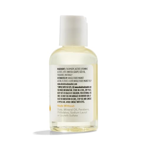 365 Vitamin E Skin Oil pour image—easy to apply a small amount.