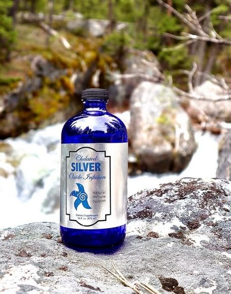 Dropper dispensing the Silver Infusion liquid