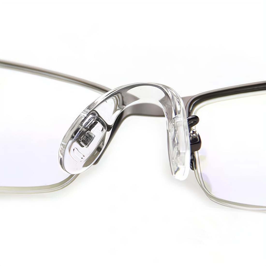 Repair kit contents: nose pads, screws, tweezers, screwdriver, case