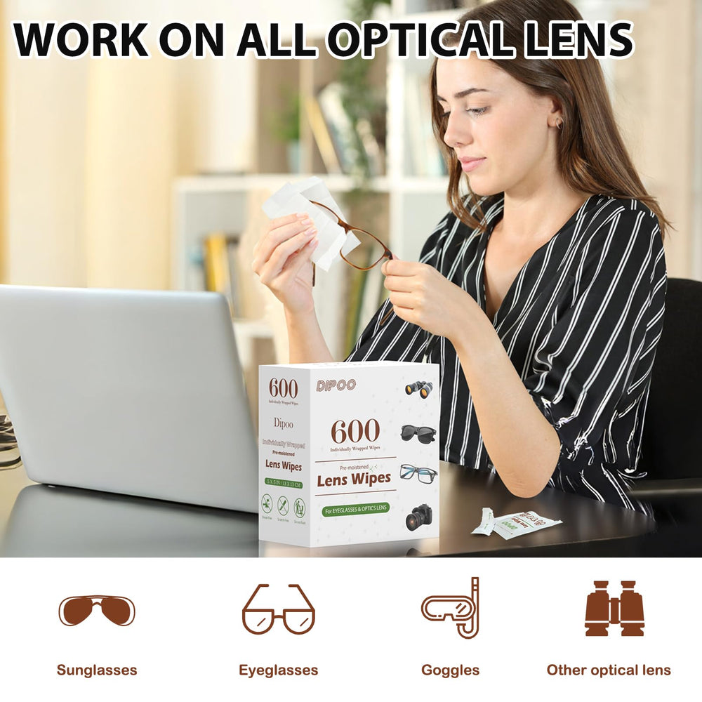 Eyeglasses lens being cleaned with a wipe