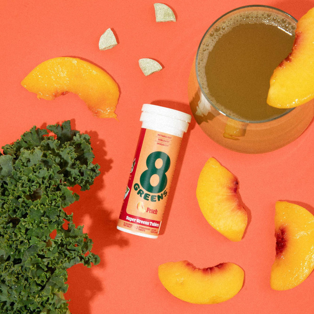 Organic greens blend tablet on white background