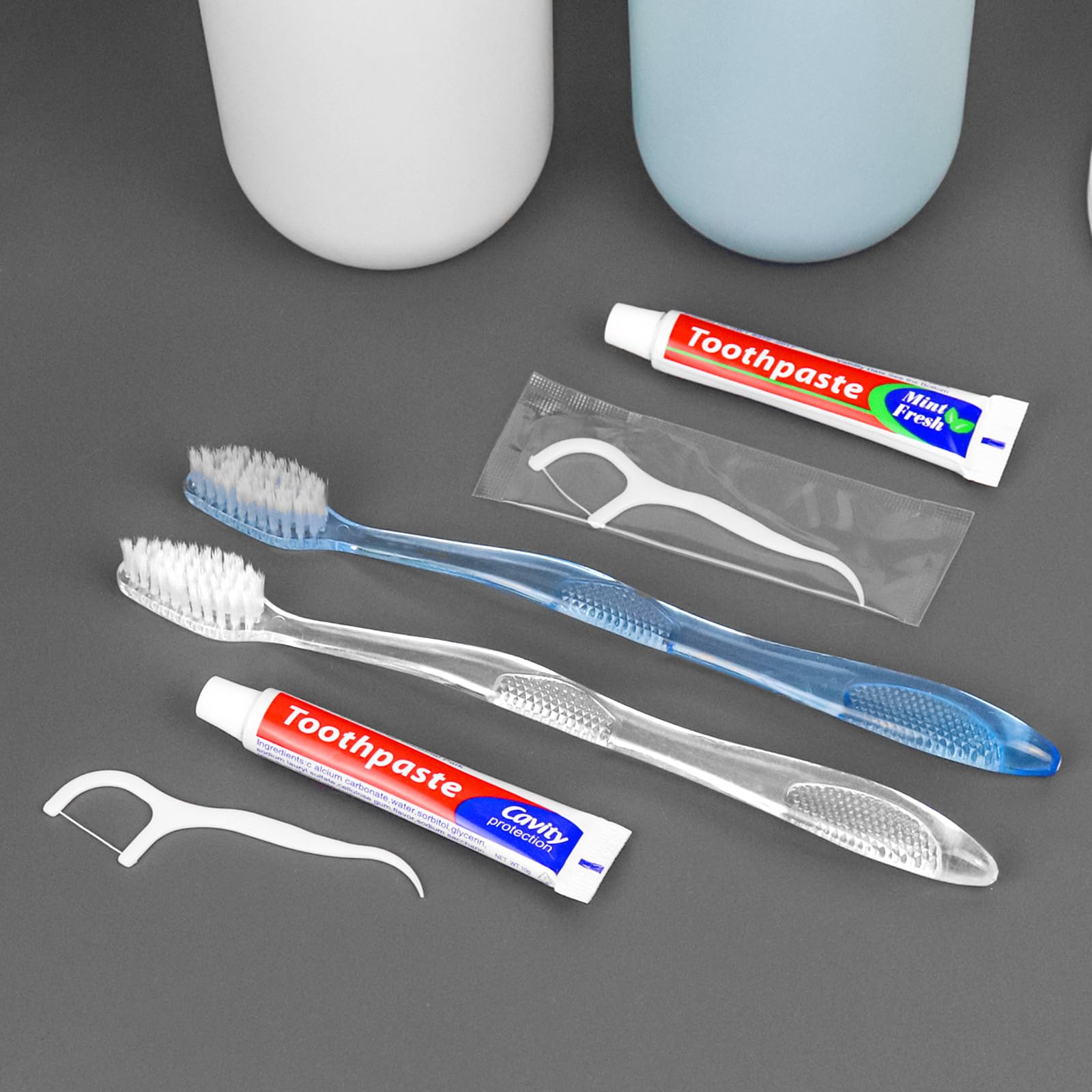 Individually wrapped toothbrush with toothpaste and floss