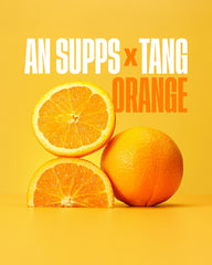 ABE all black everything ANP Tang Orange glass with water, suggesting hydration-focused pre-workout use.