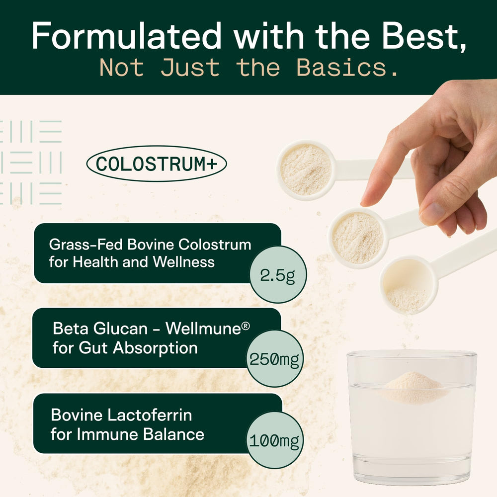 Glass of water with mixed colostrum powder and scoop