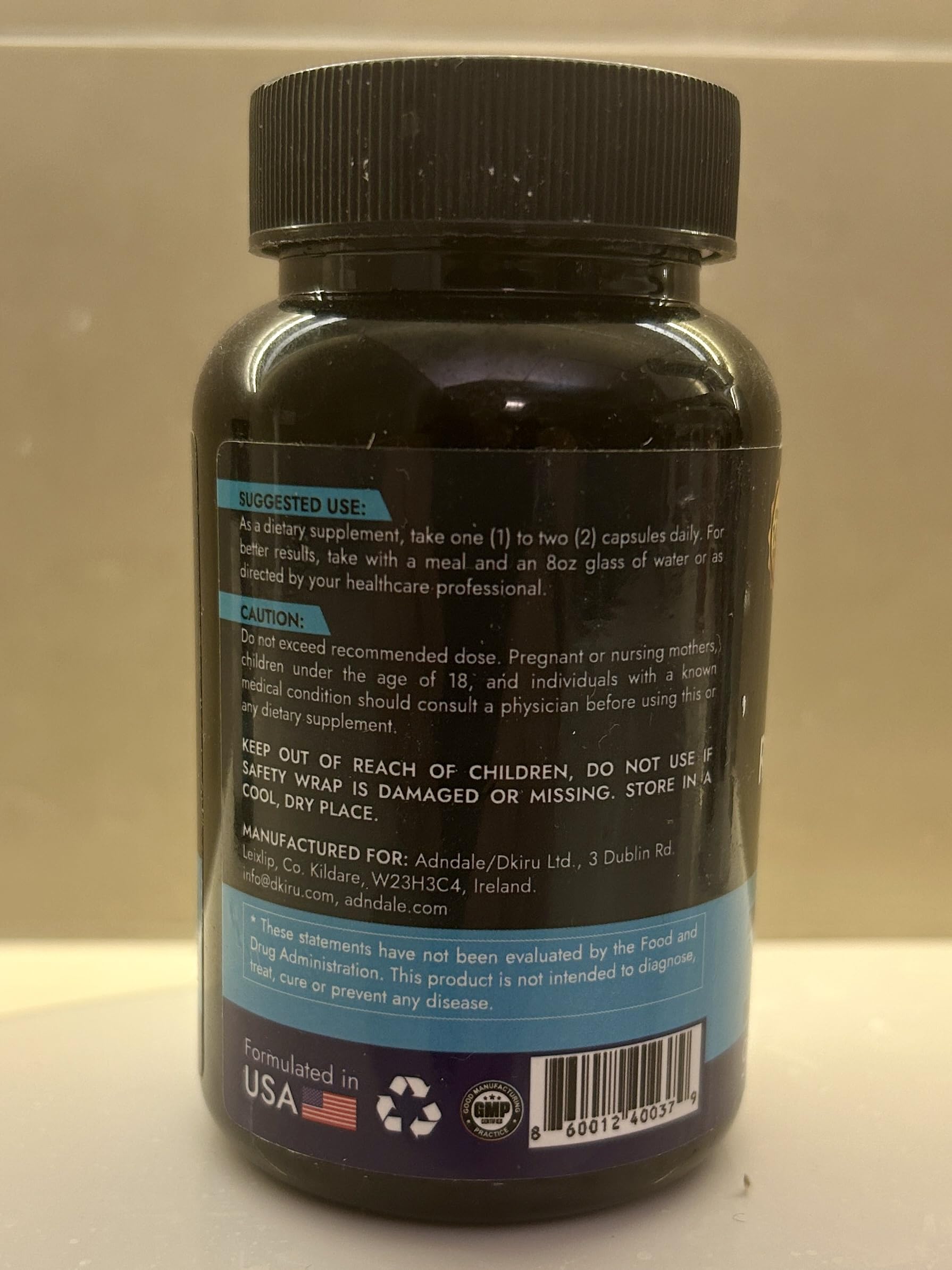 Two bottles of Adndale NAD+ Supplement on a desk