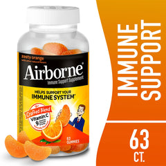 Bottle of Airborne Vitamin C immune support gummies with gummies nearby