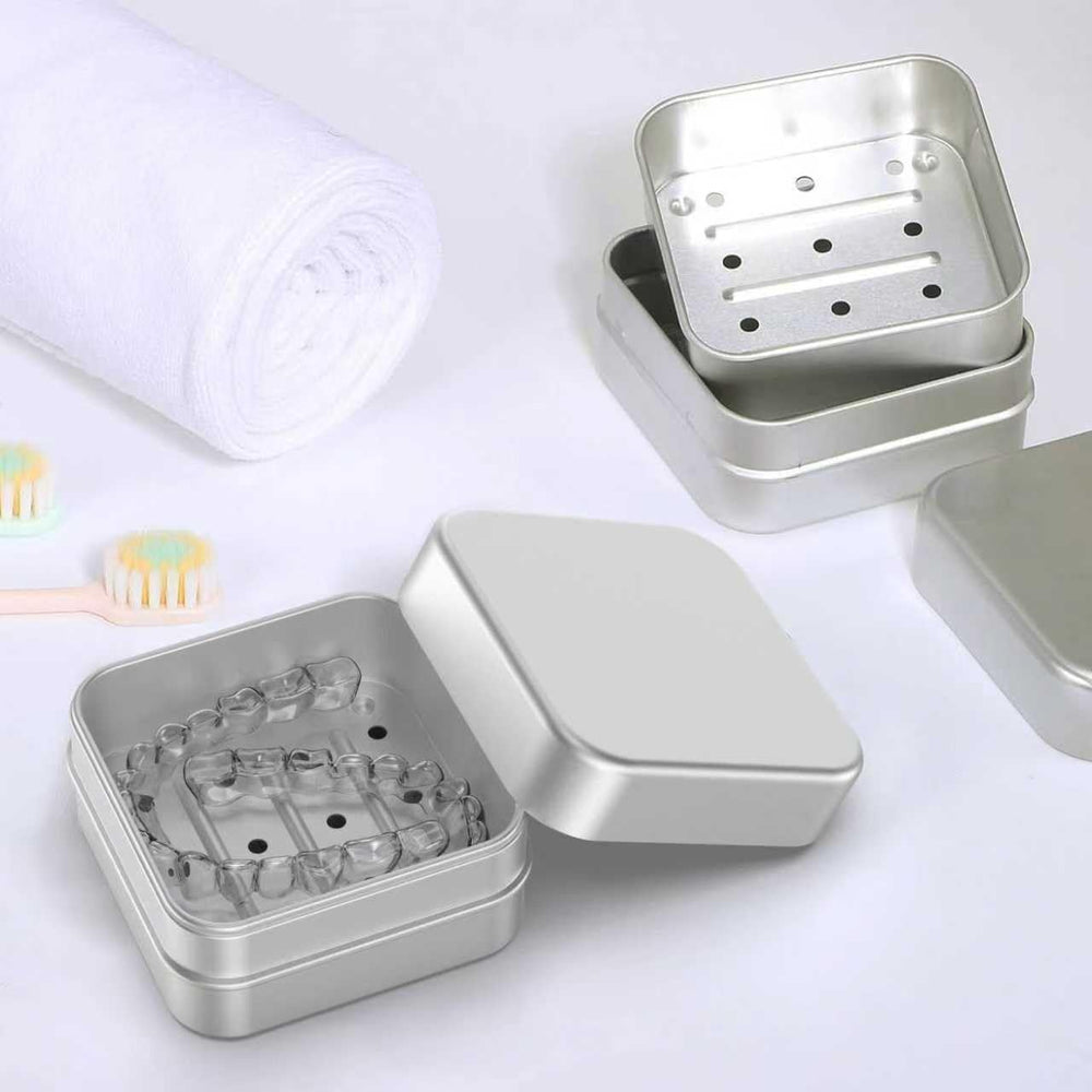 Compact aluminum alloy denture case on white background