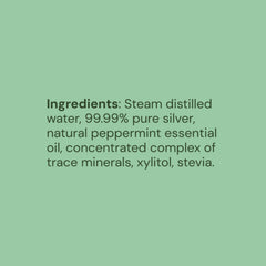 Close-up of mint-flavored mouthwash liquid in a clear bottle