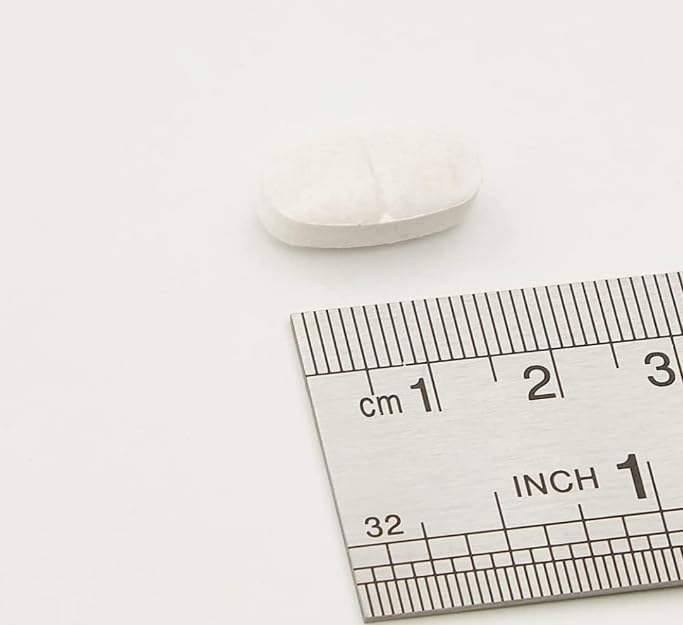 Close-up of supplement capsules showing Magnesium, Vitamin B6 and Melatonin