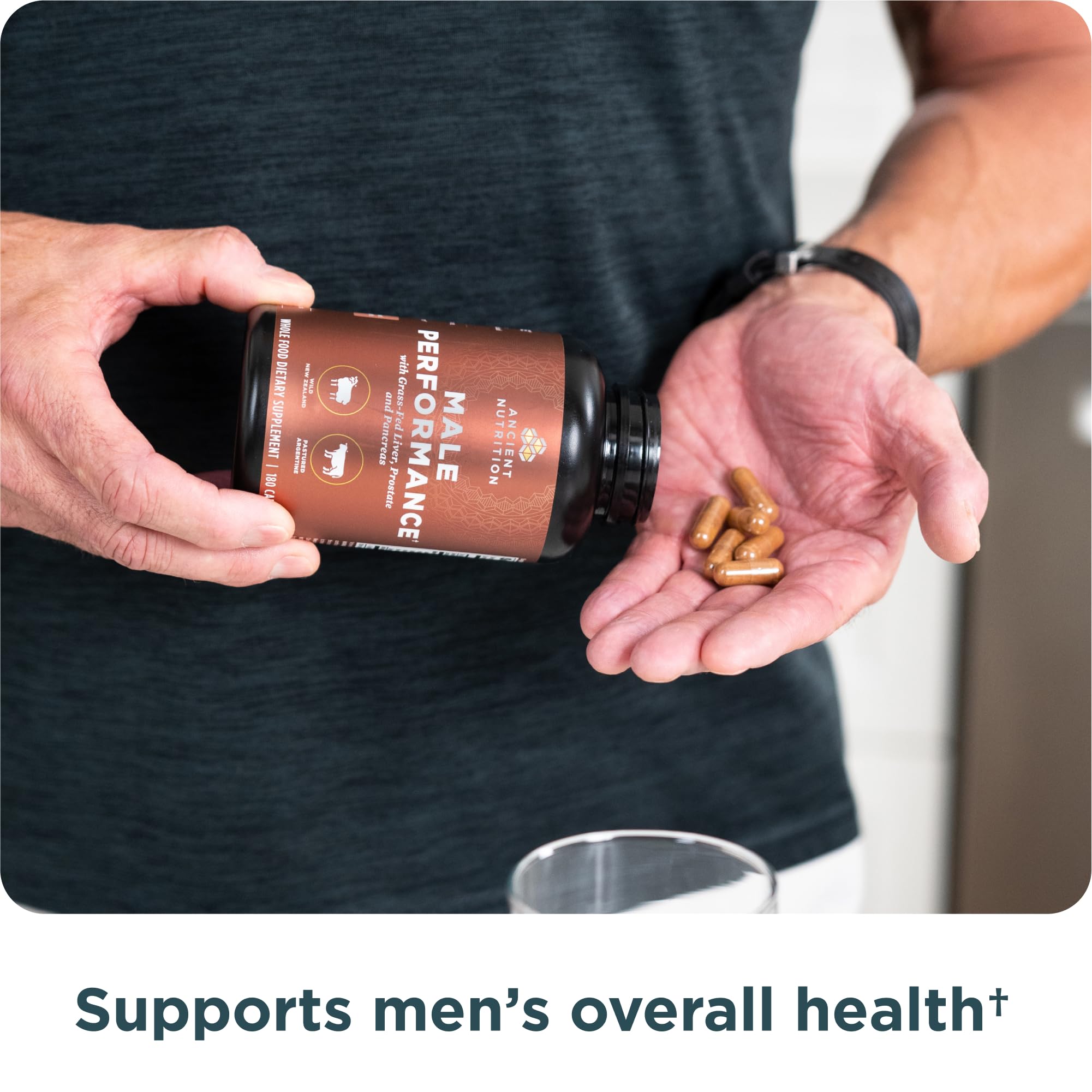 Man taking organ supplement for performance