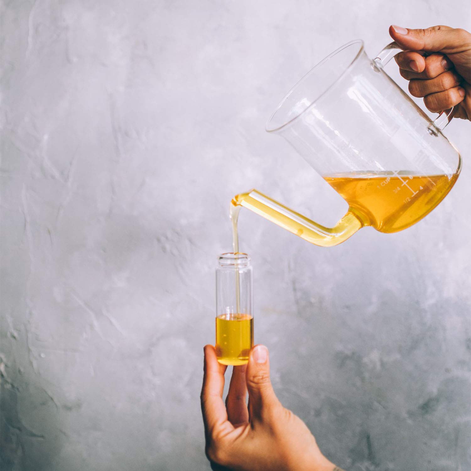 Dropper applying oil to skin