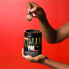 Athlete mixing Animal Pak powder into a beverage