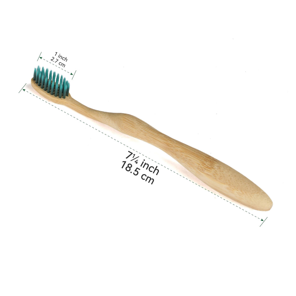 Compostable packaging and bamboo toothbrush on natural backdrop