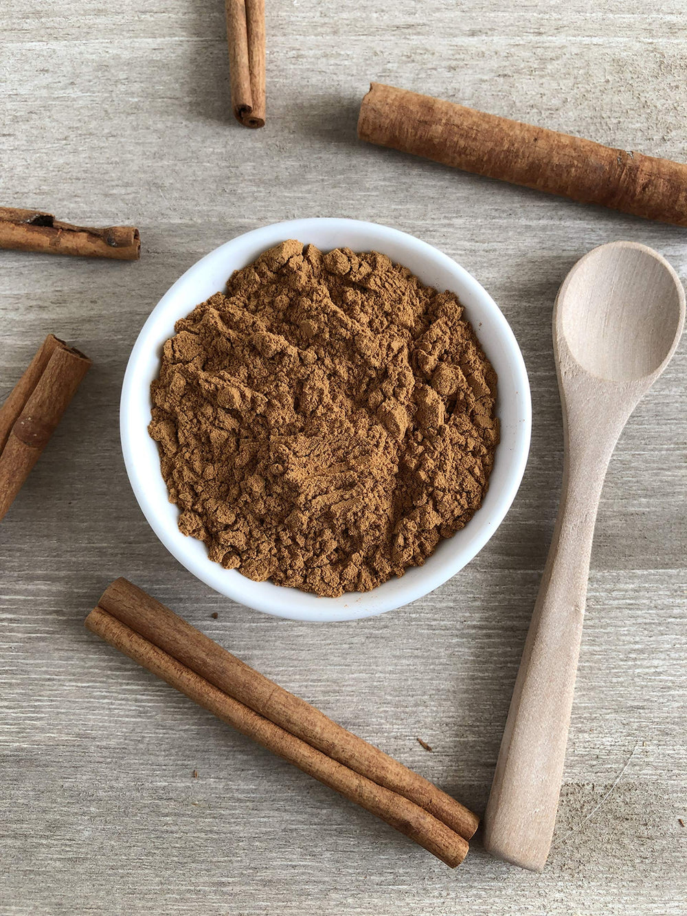 Anthony's Cinnamon Powder texture closeup with vibrant color and granules.