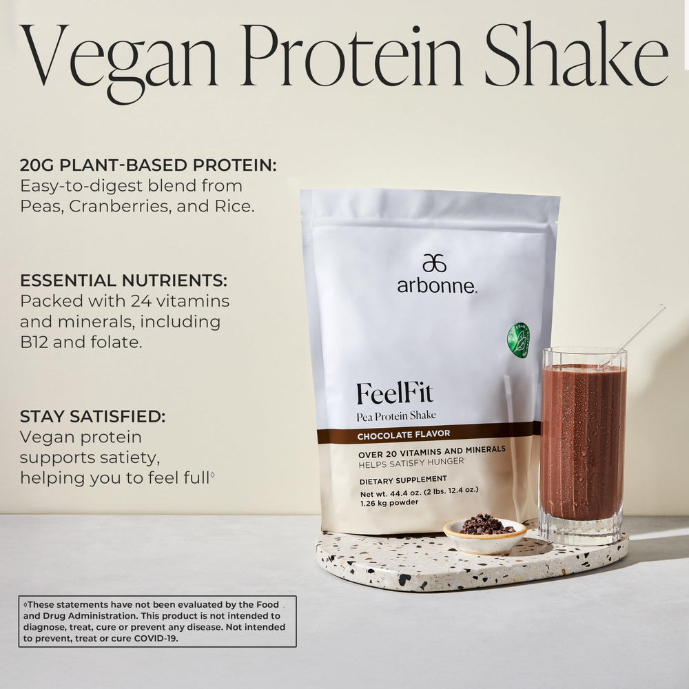 Arbonne Feelfit pea protein shake chocolate served in a glass for convenient consumption
