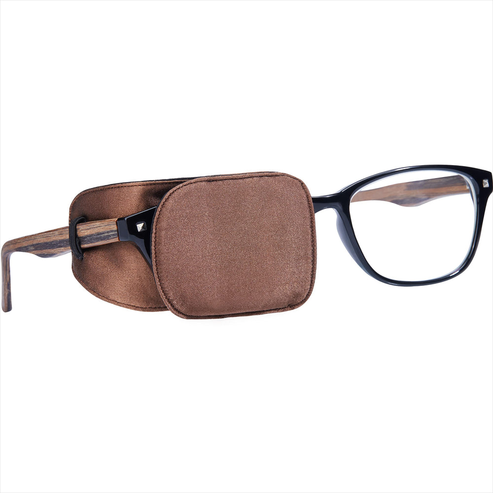 Astropic Silk Eye Patch in brown worn over glasses (medium)
