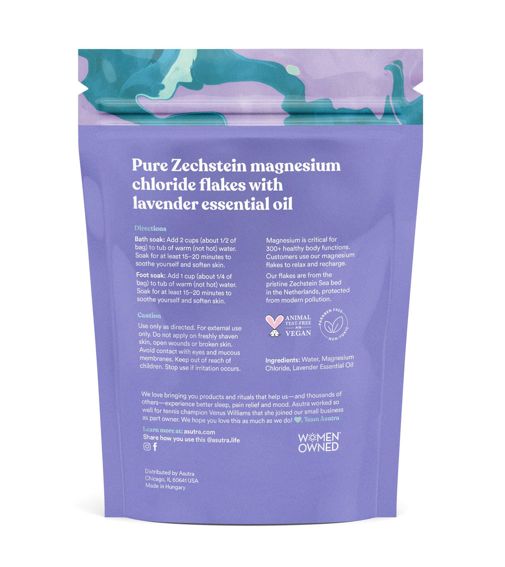 Close-up of dissolving bath flakes in warm water with lavender aroma