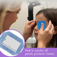 Occluder patch adhesive with center paper pad