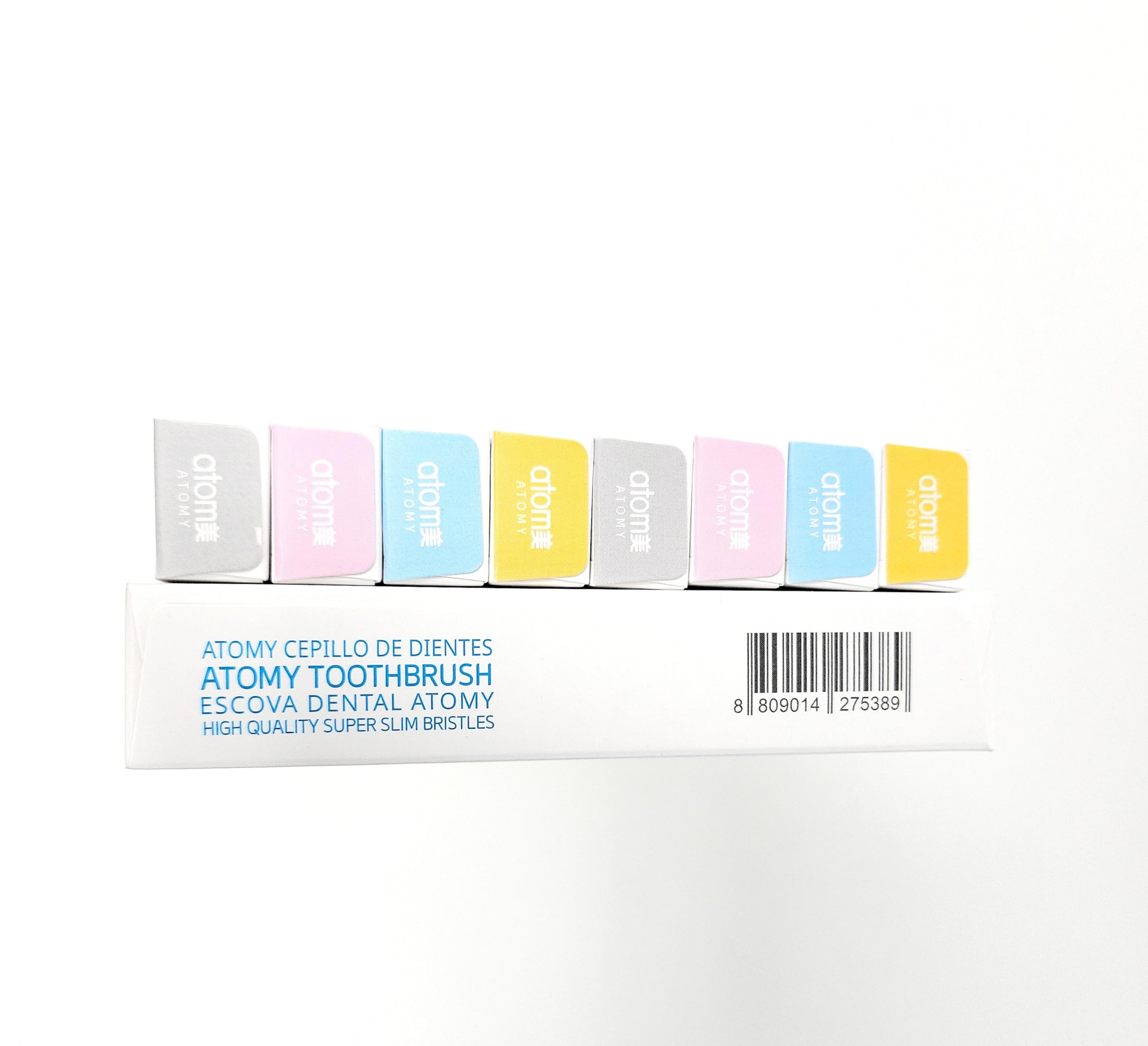 Close-up of ultra-slim Atomy toothbrush set showing 0.02mm thickness