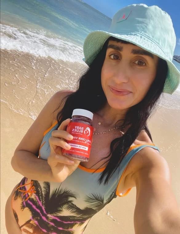 Baby Blues soft gummy atop glass water suggests easy daily ritual