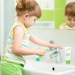 Close-up of toothpaste tube labeled fluoride-free