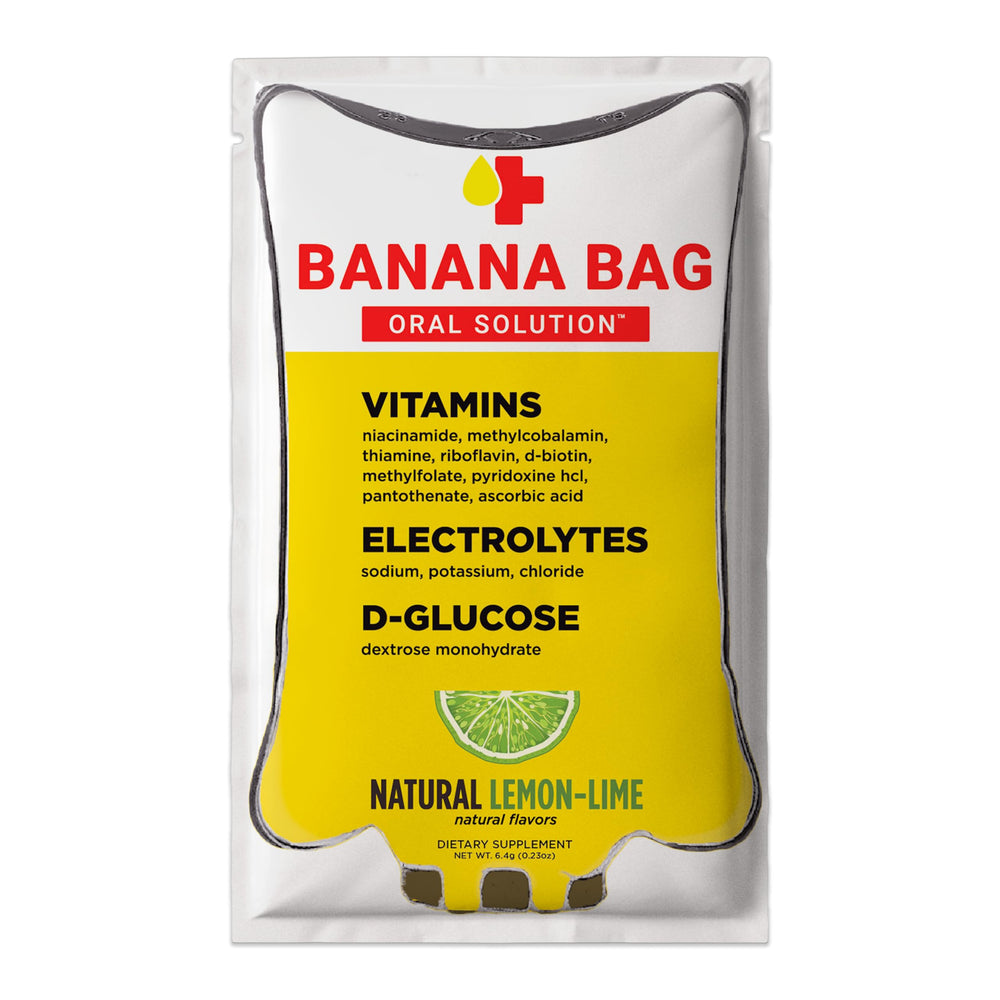 Banana Bag Oral Solution packets lemon-lime in glass for easy daily hydration