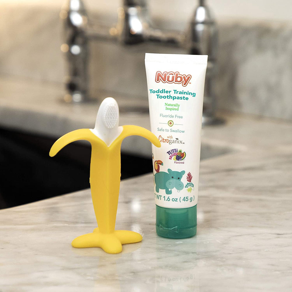 Banana-shaped toothbrush with soft bristles for gentle cleaning