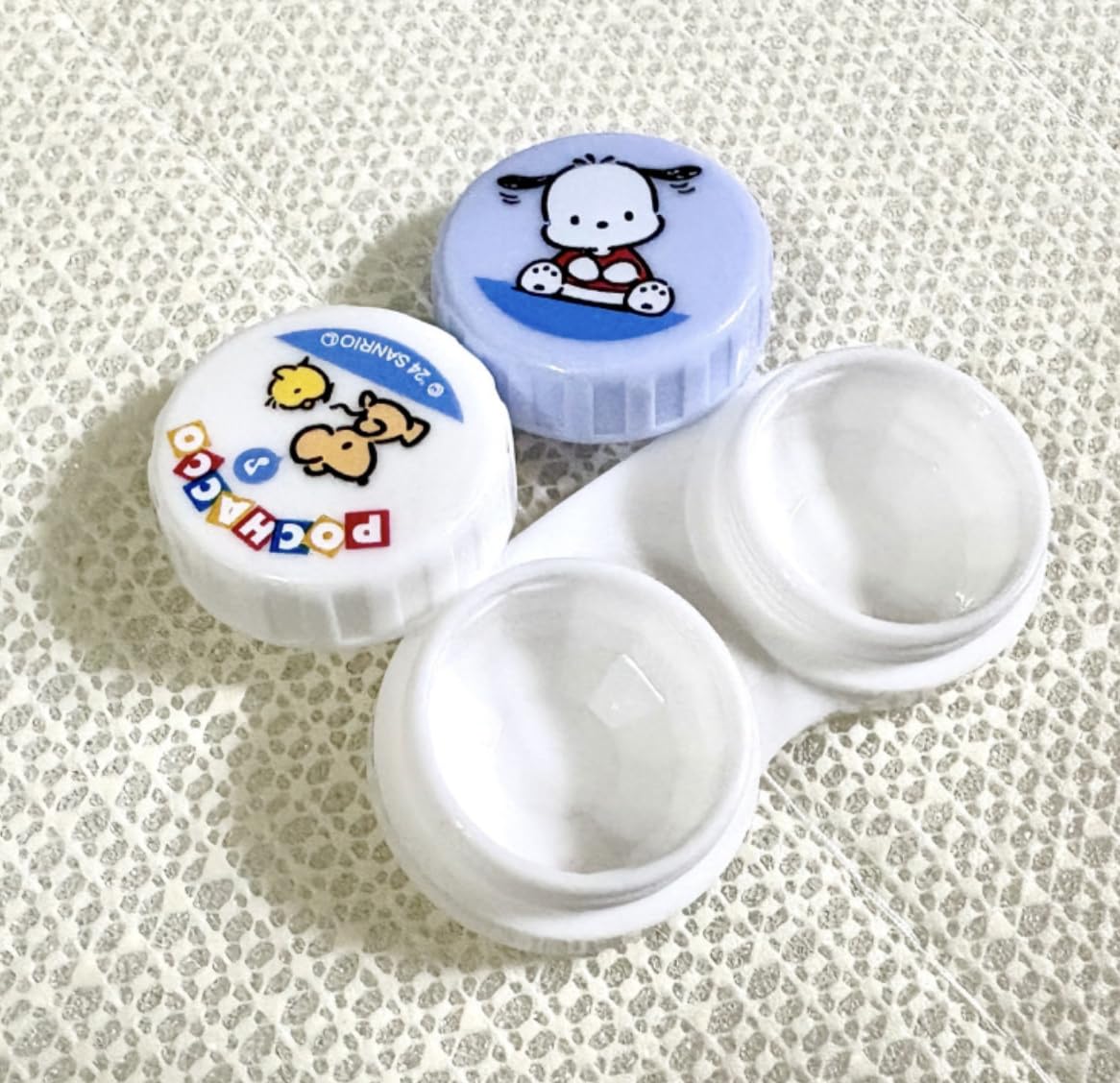 Compact travel-friendly Bandal & Neoul Pochacco contact lens case set