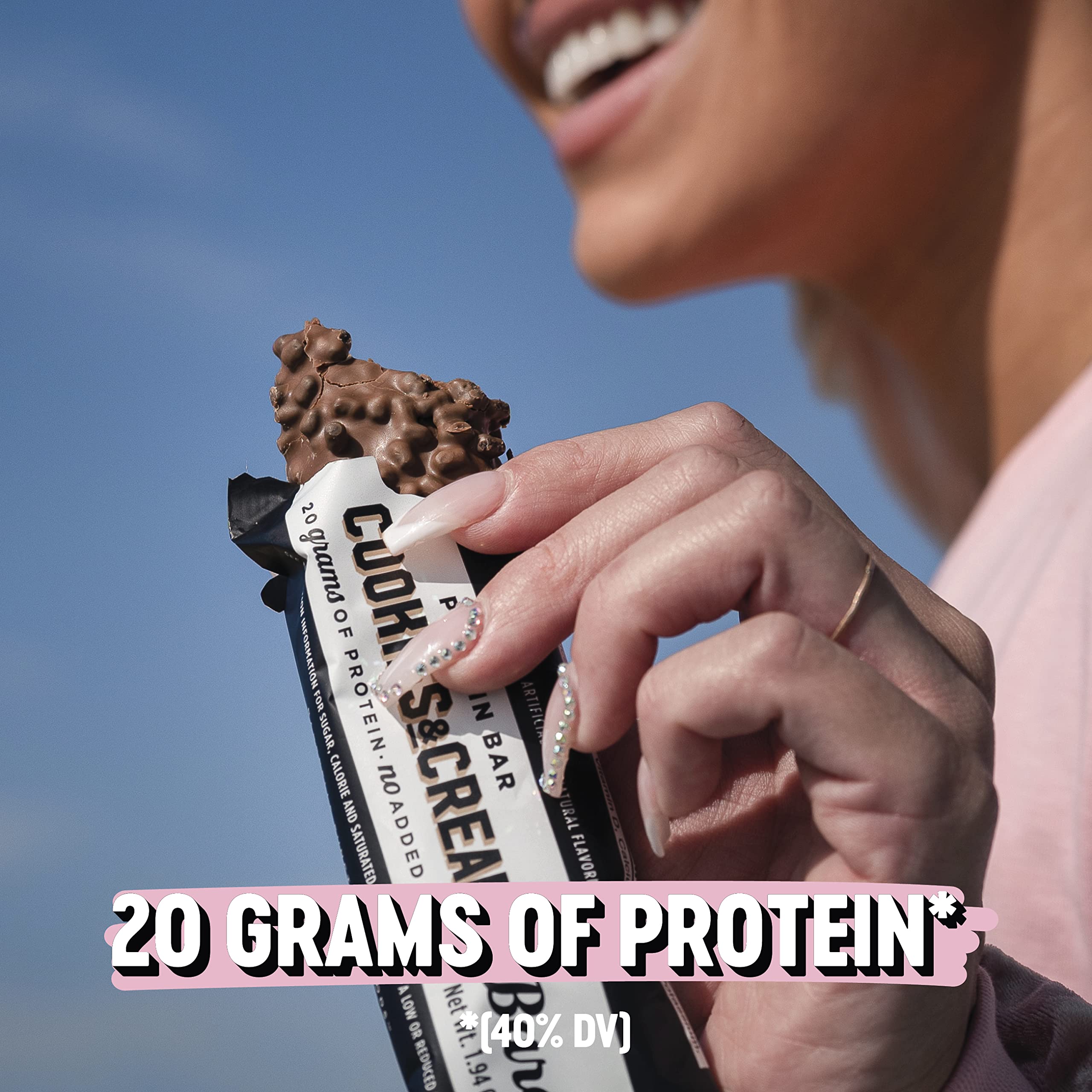 Barebells bar beside an apple, tasty afternoon treat for cravings.