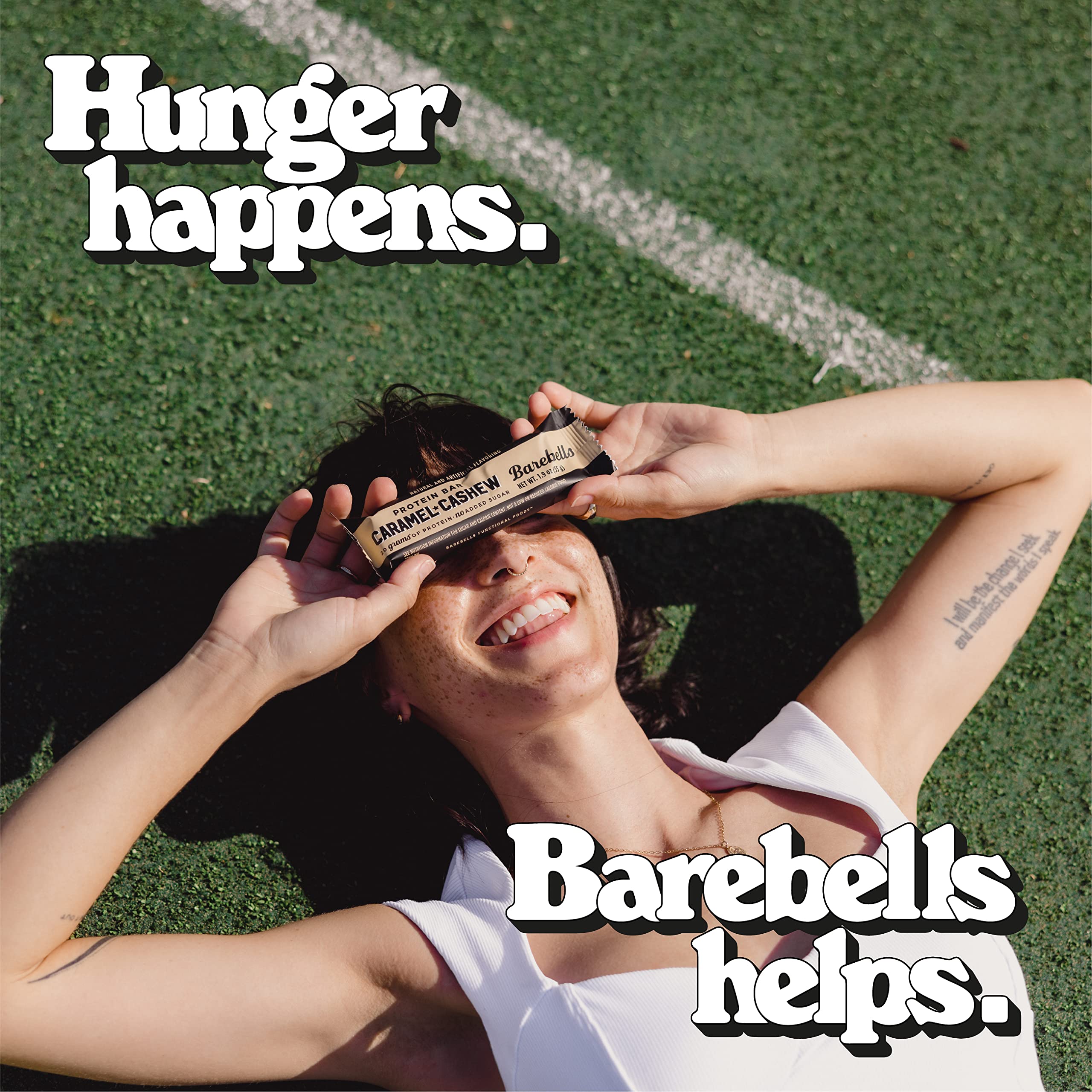 Barebells Caramel Cashew Cookies & Cream bar bite reveals creamy center.