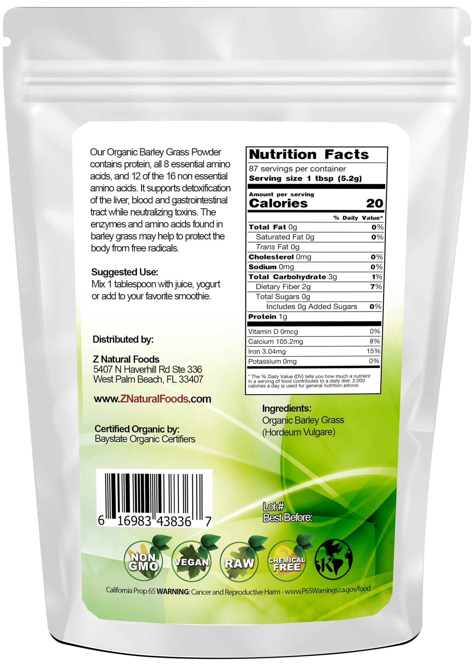 Scoop of barley grass powder on a white surface